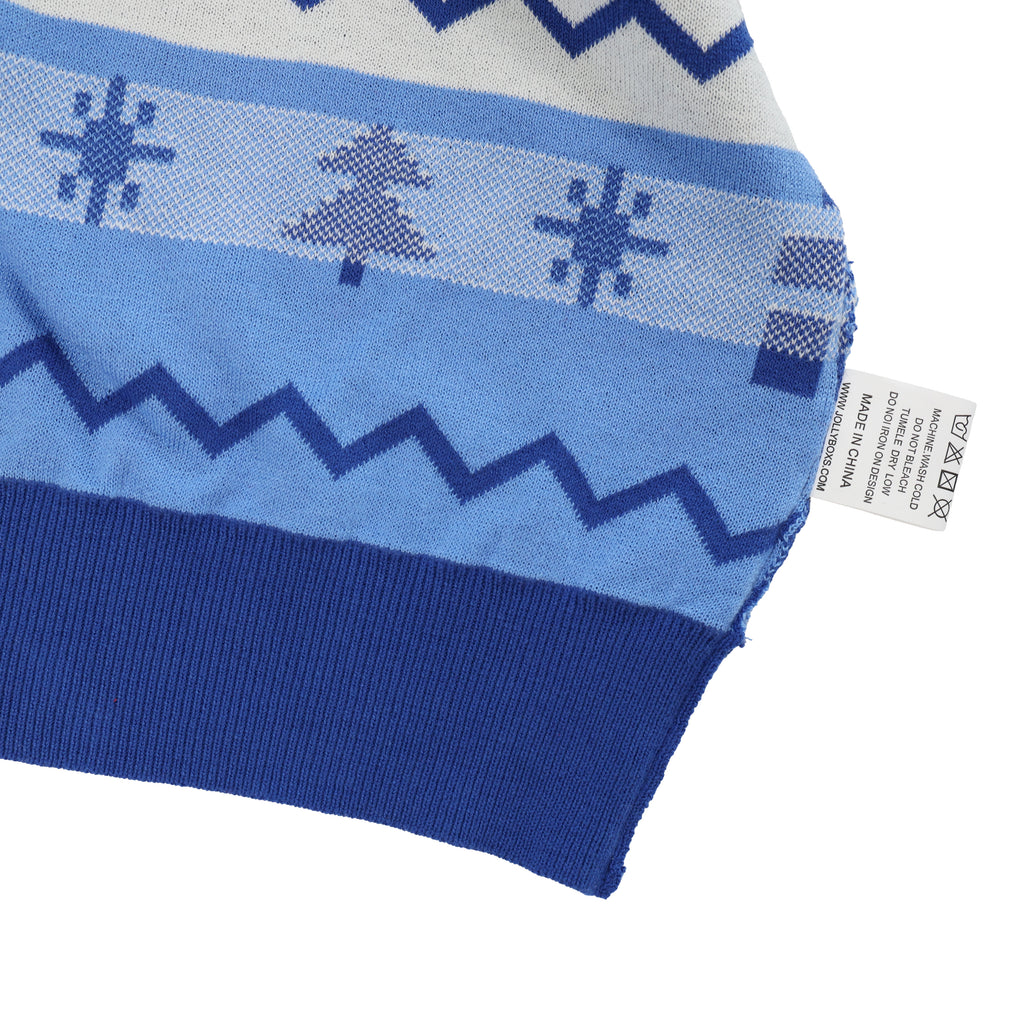 Close-up of a blue and white patterned ugly christmas sweater with a tag on a white background
