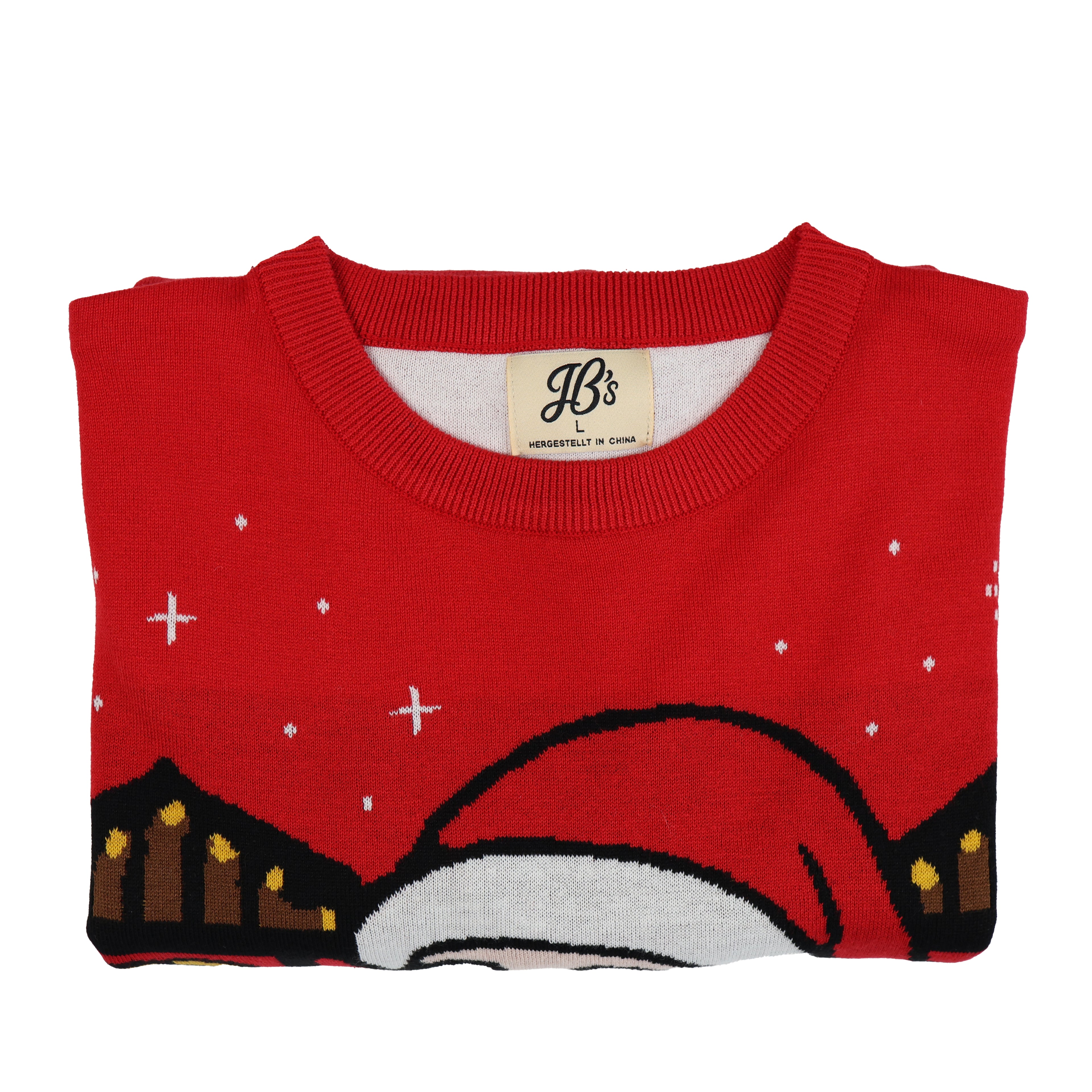 Folded red ugly Christmas sweater with festive design on a white background