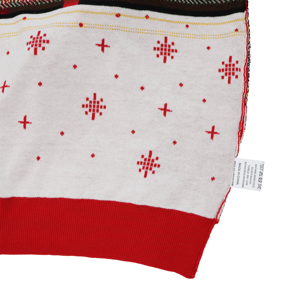 Close-up of a red and white fabric of ugly Christmas with snowflake pattern and label on a white background