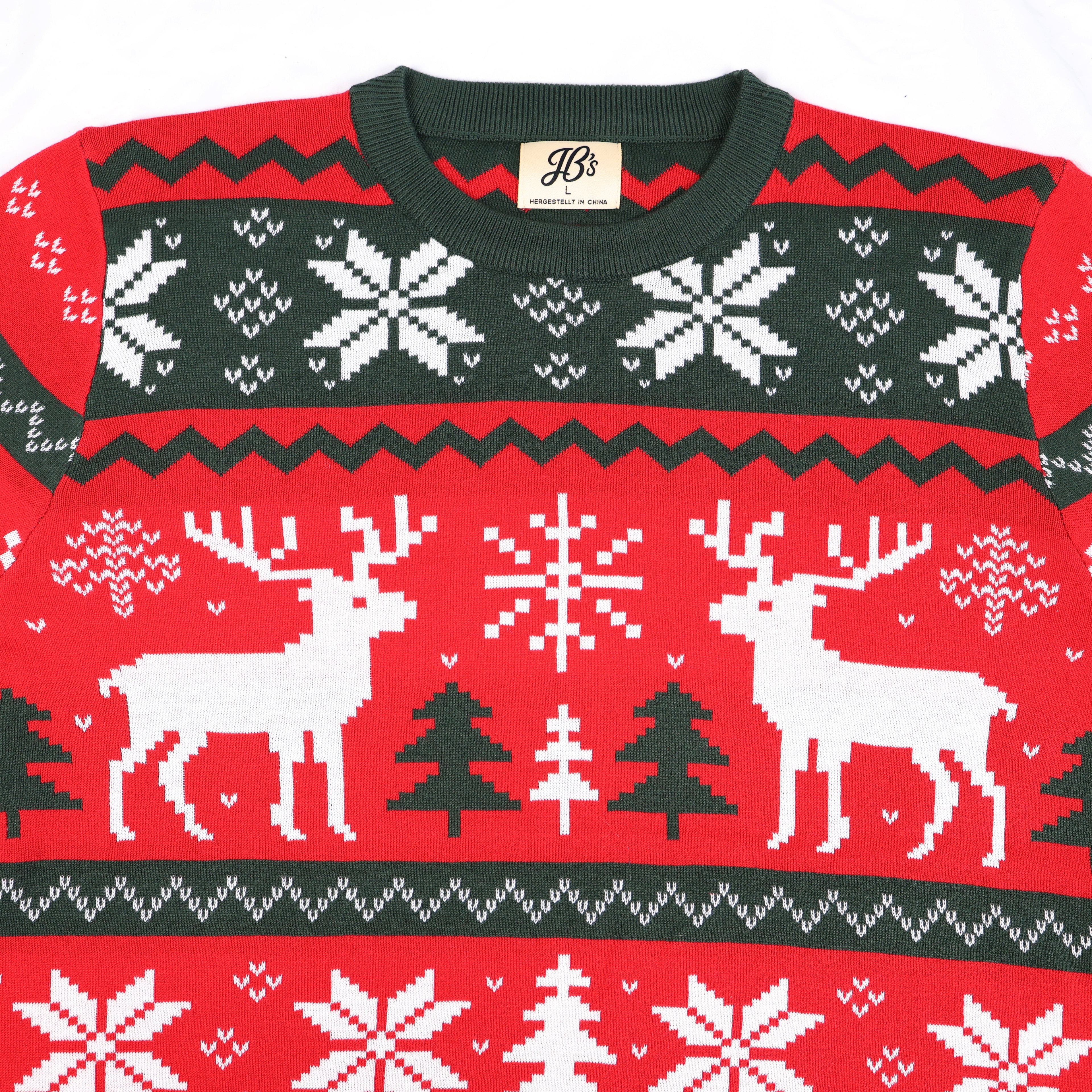 Red ugly Christmas sweater with reindeer, trees, and snowflakes on a white background